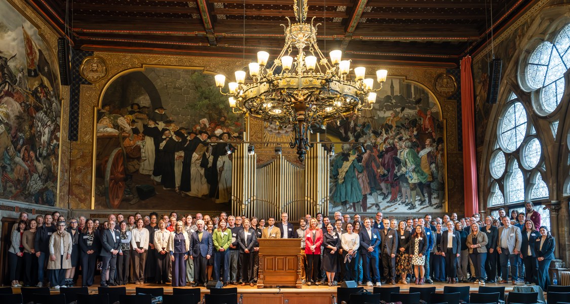 group photo in the auditorium of the Old University